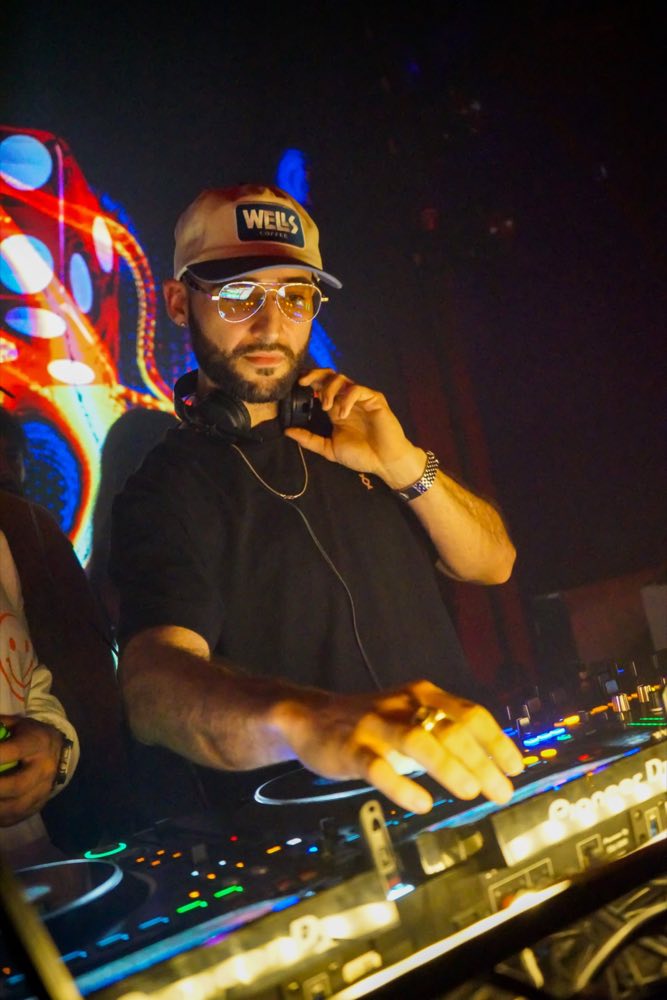 Stormy McGee mixing on Pioneer decks under club lights
